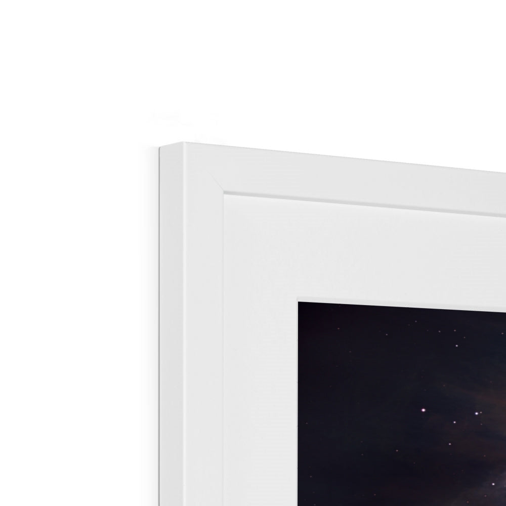 Close-up of the top corner of an Orion Nebula framed print showing the white frame, white mount and image