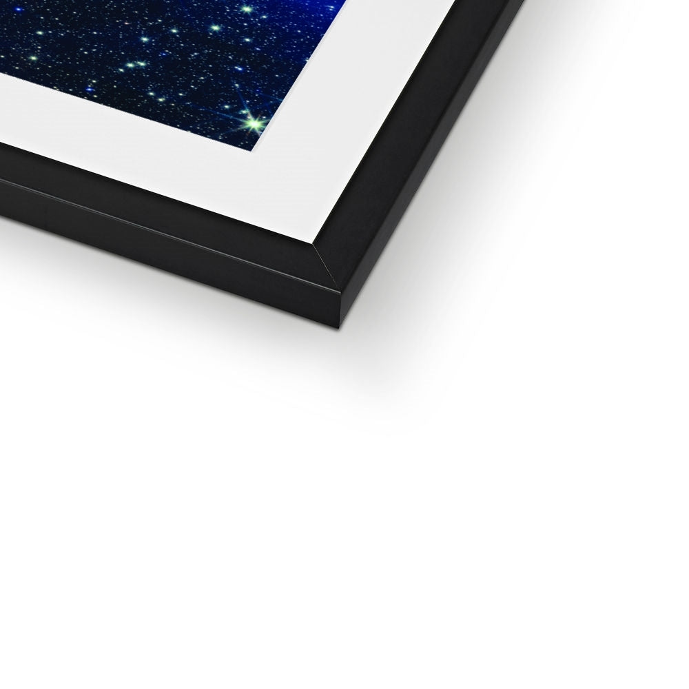 Close-up of the bottom corner of a Pillars of Creation framed print showing the black frame and white mount