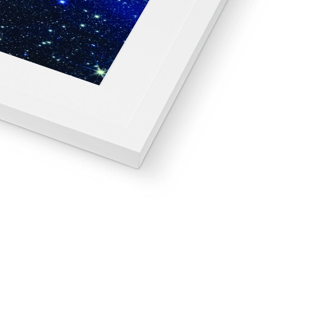 Close-up of the bottom corner of a Pillars of Creation framed print showing the white frame and white mount