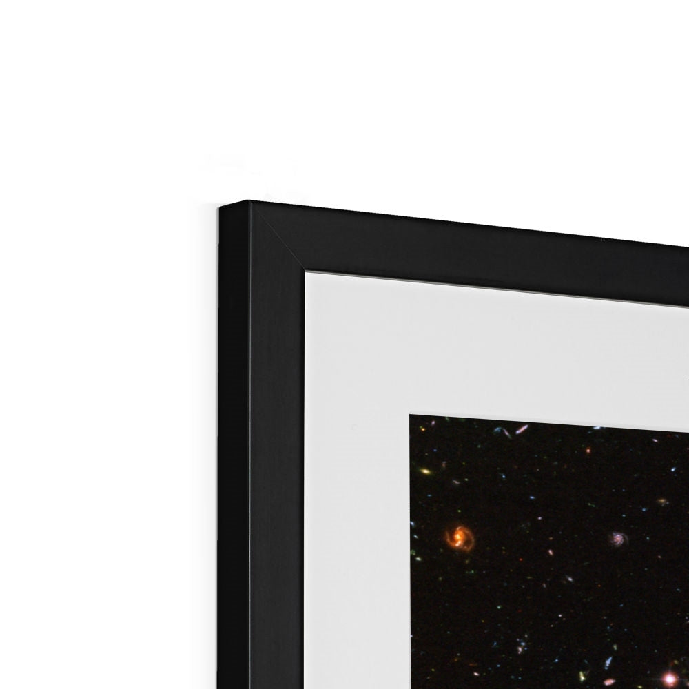 Close-up of the top corner of a JWST Deep Field framed print showing the black frame, white mount and image