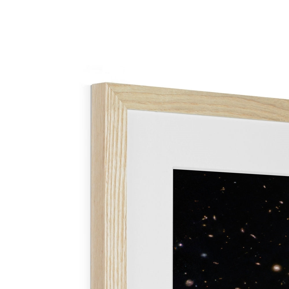 Close-up of the top corner of a Spiral Amongst Thousands framed print showing the natural wood frame, white mount and image
