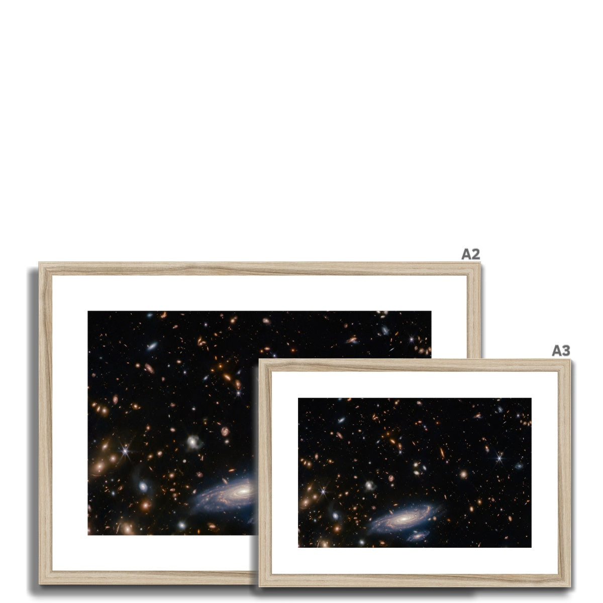 Size comparison of Spiral Amongst Thousands framed and mounted prints in a natural wood frame, A3 and A2
