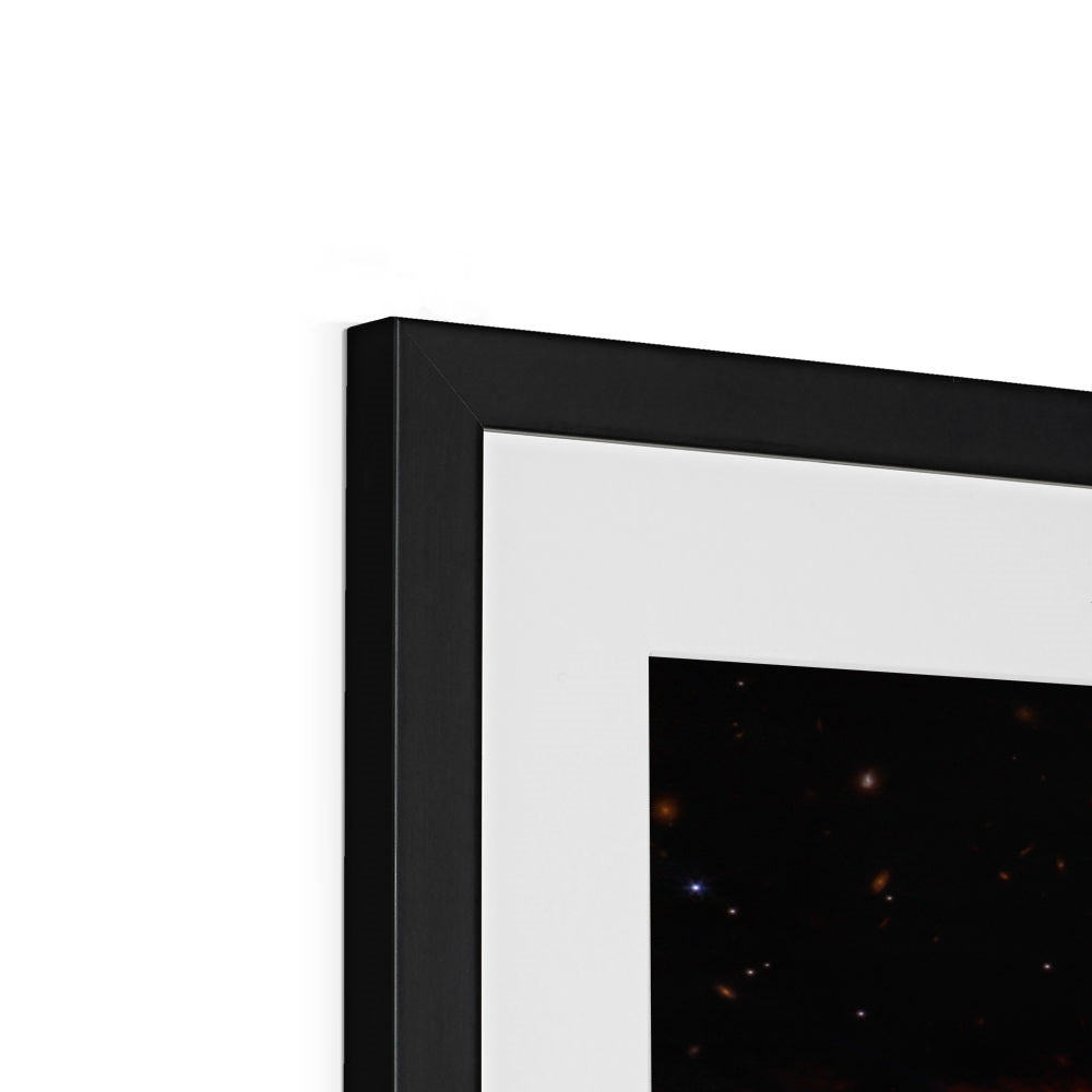 Close-up of the top corner of a Southern Ring Nebula framed print showing the black frame, white mount and image
