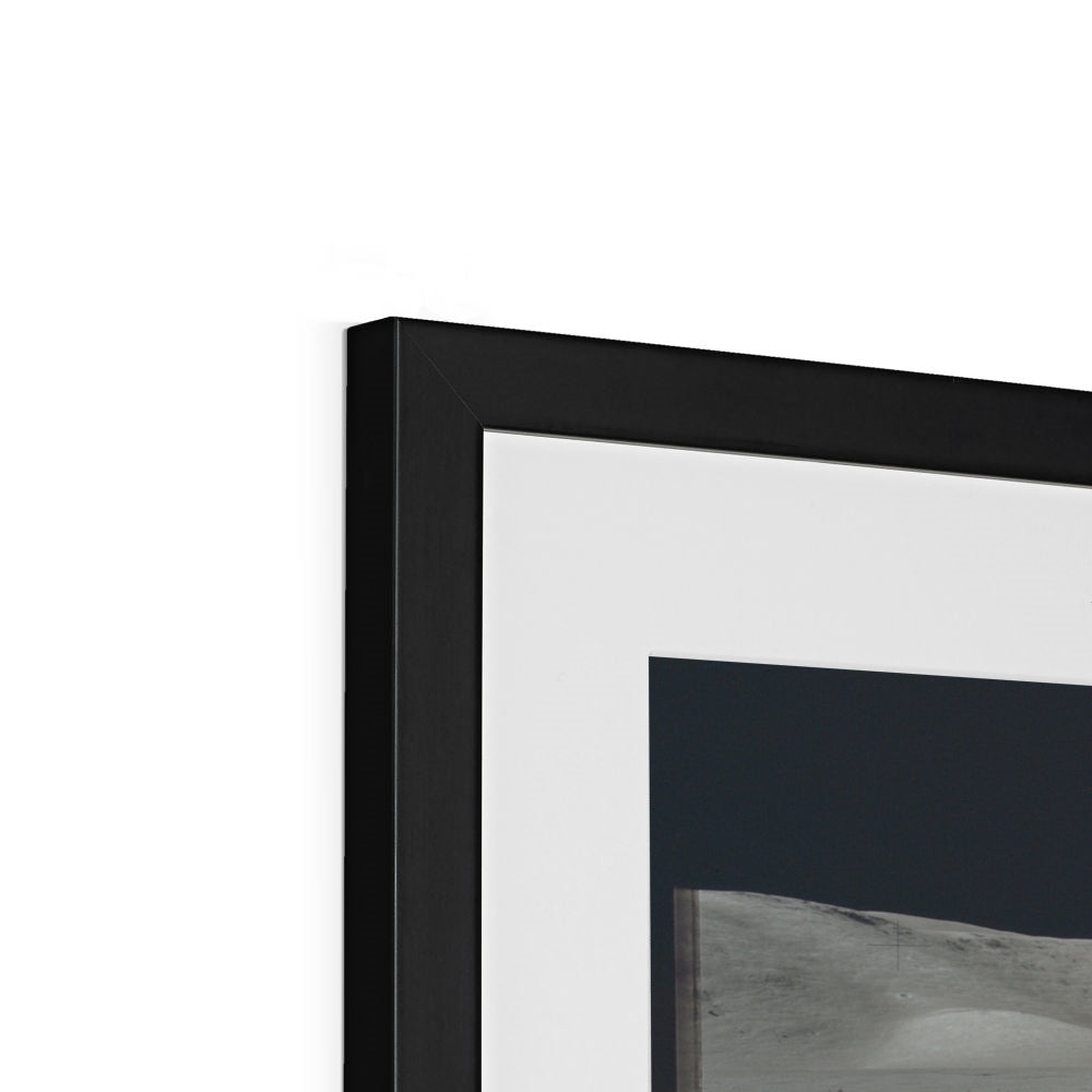 Close-up of the top corner of a North Massif Boulder framed print showing the black frame, white mount and image