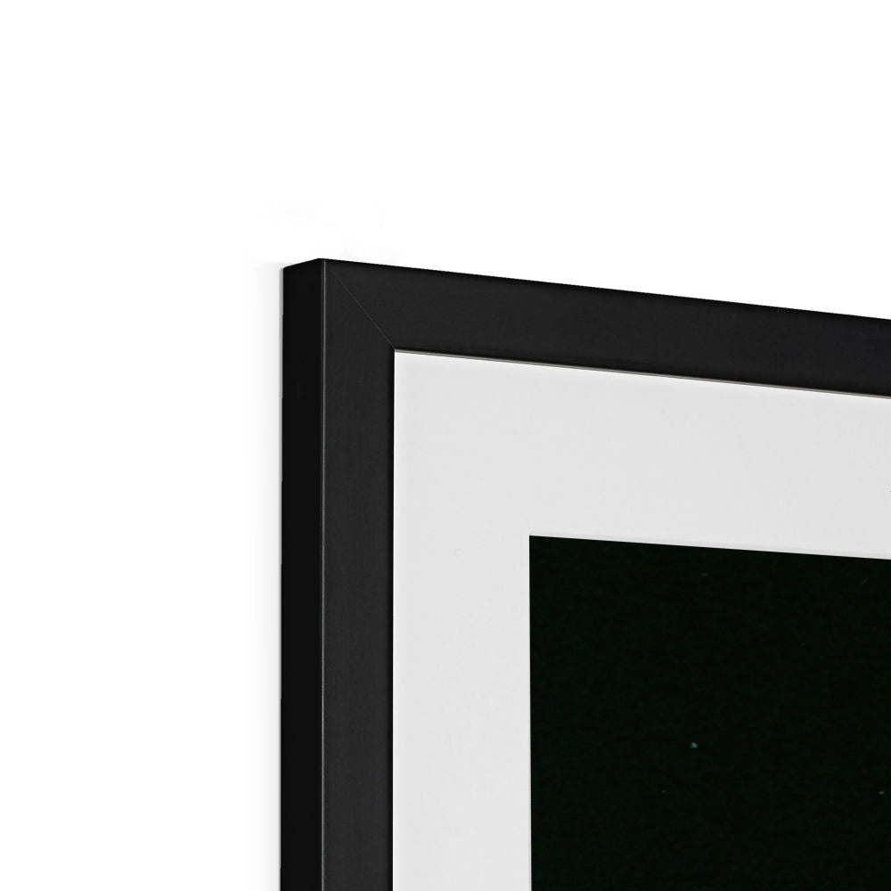 Close-up of the top corner of an Earthrise framed print showing the black frame, white mount and image