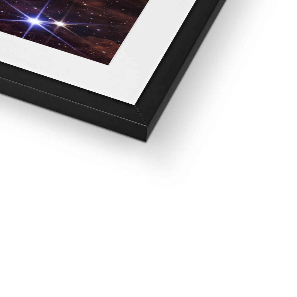 Close-up of the bottom corner of a Cosmic Cliffs framed print showing the black frame and white mount