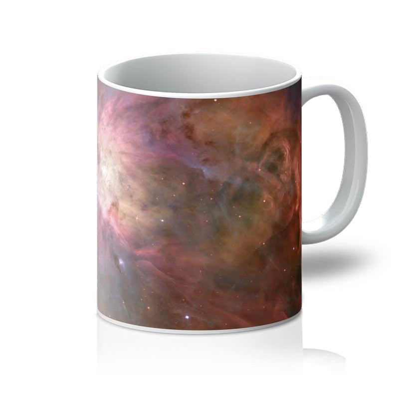 Orion Nebula 11oz white mug printed with glowing clouds of gas and young stars, handle on the right