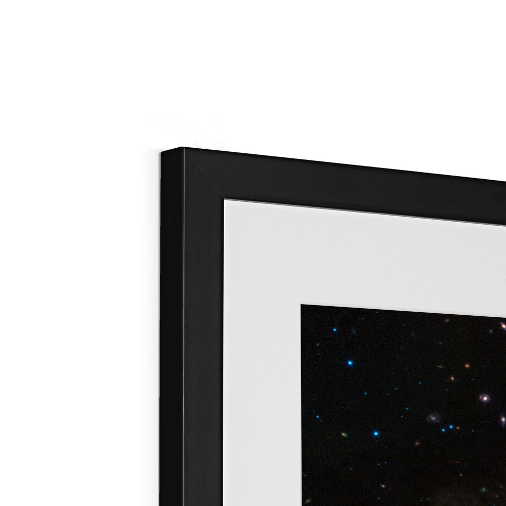 Close-up of the top corner of a Crab Nebula framed print showing the black frame, white mount and image