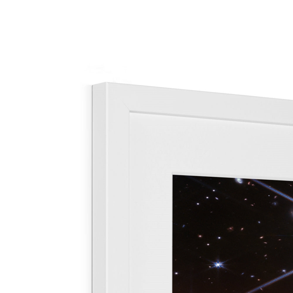 Close-up of the top corner of a Behind the Horsehead Nebula framed print showing the white frame, white mount and image