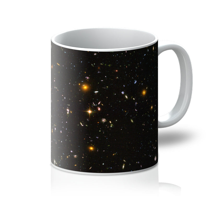 James Webb Deep Field 11oz white mug printed with thousands of distant galaxies, handle on the right